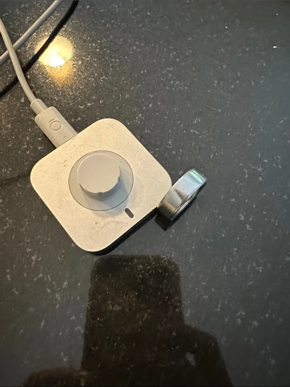 Oura Silver Charging Dock with silver ring
